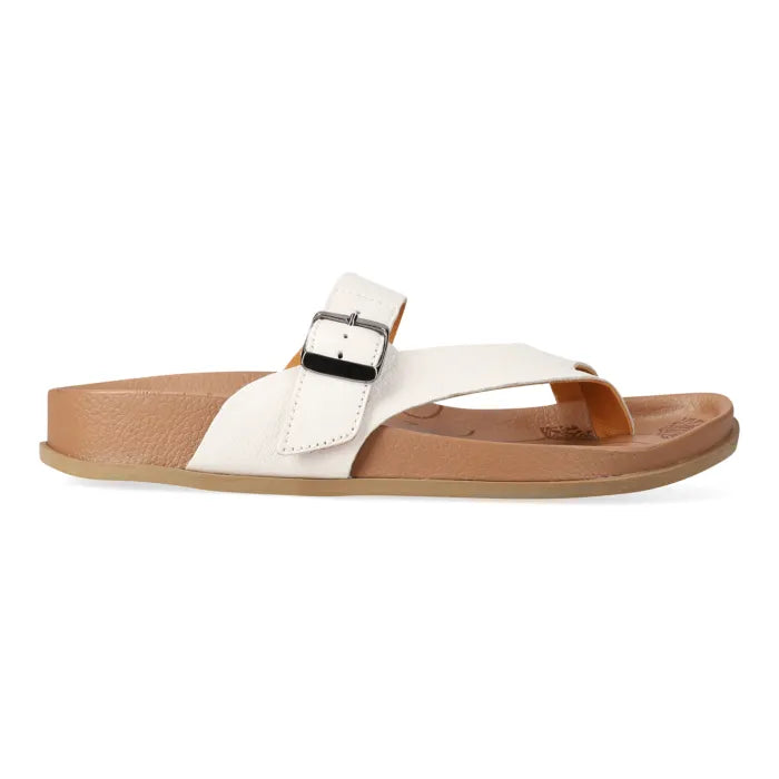 White sandal with a brown sole on a white background