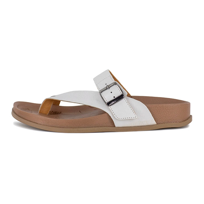 White sandal with a brown sole on a white background