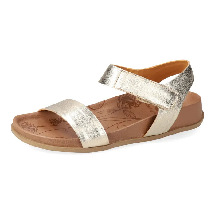 Gold sandal with a brown sole on a white background