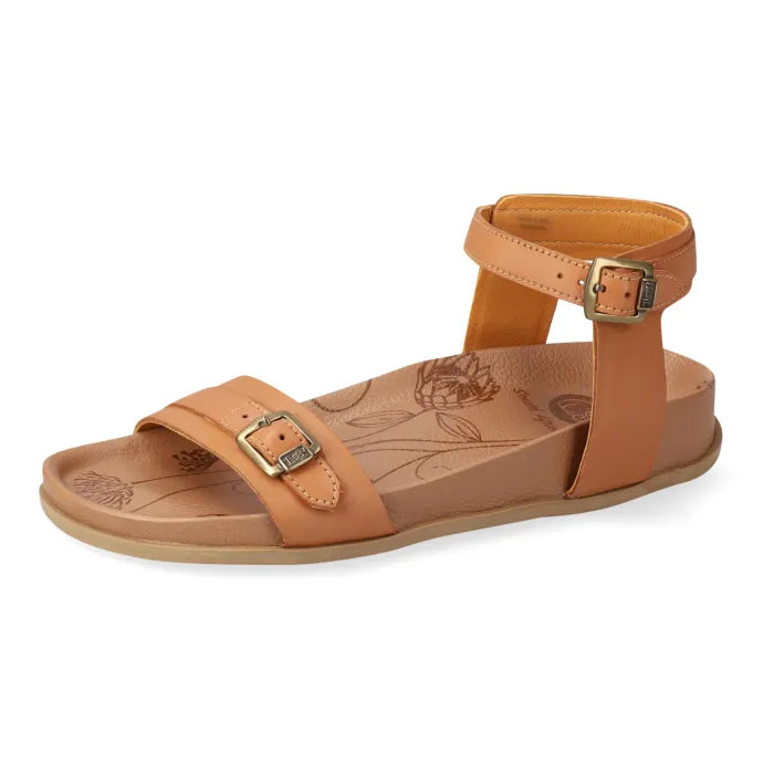 Tan sandal with gold buckles on a white background