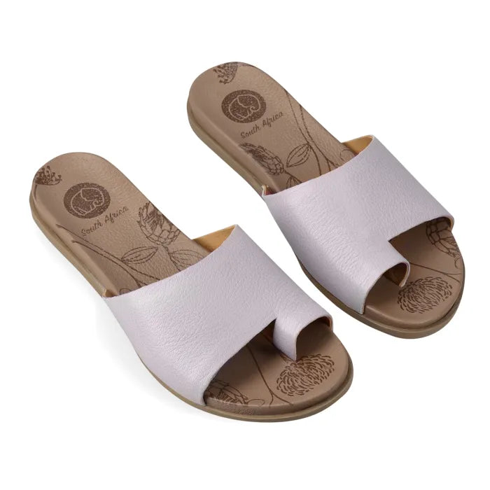 Pair of light grey sandals with beige soles on a white background