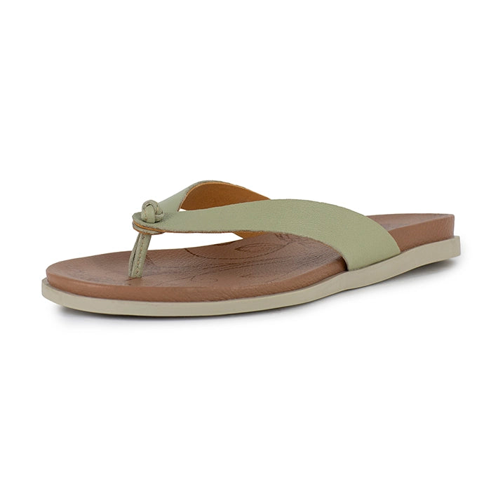 Light green sandal with brown sole on a white background
