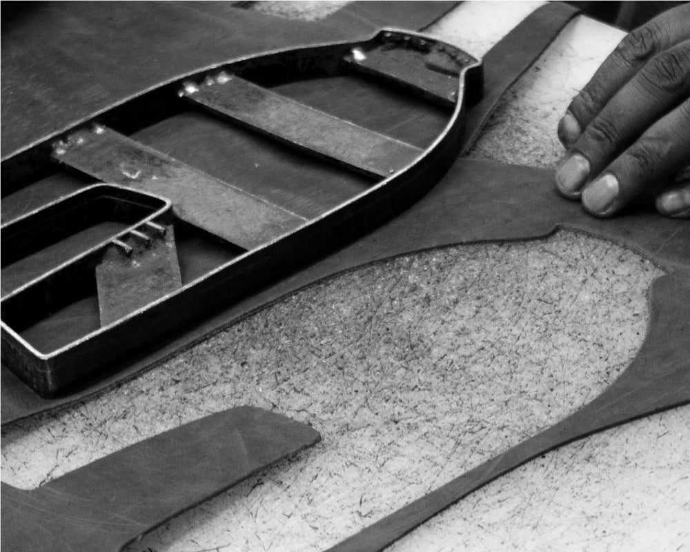 Shoe making - leather clicking department - cutting leather in to shapes