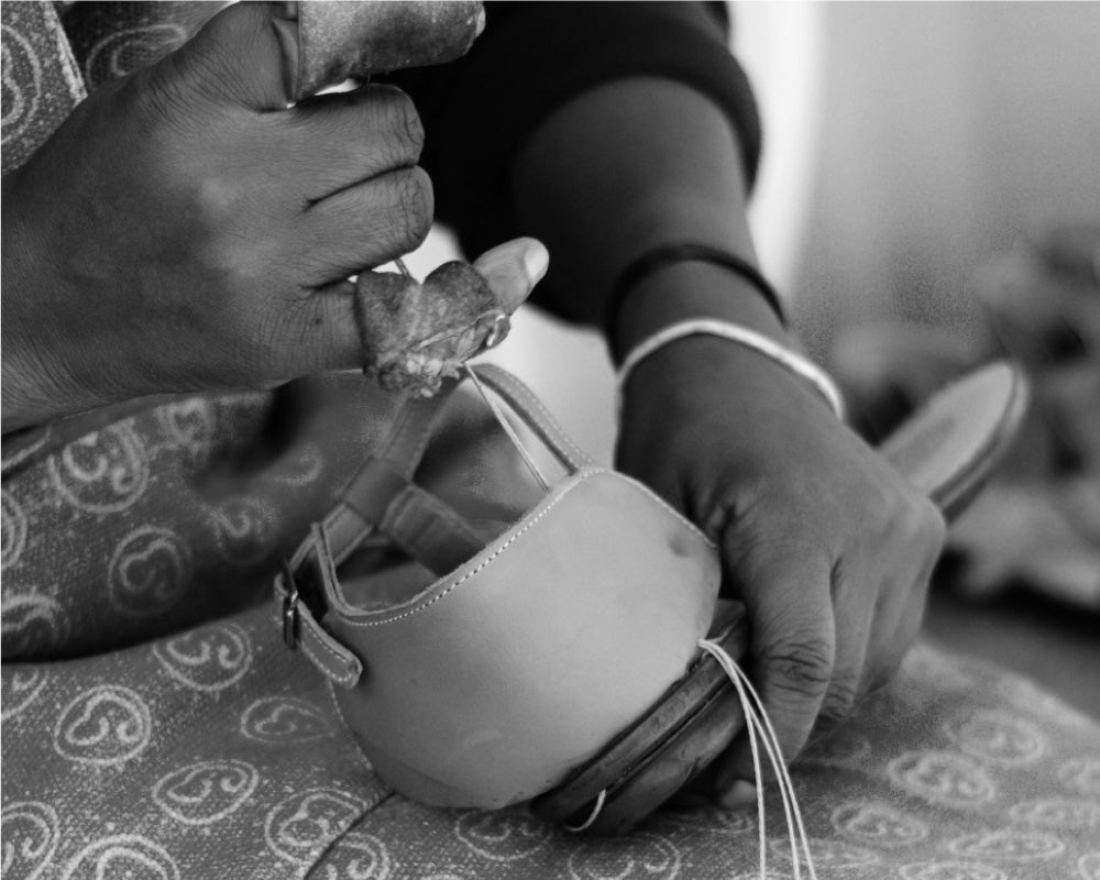 Shoe making - hand lacing upper to the sole of the shoe