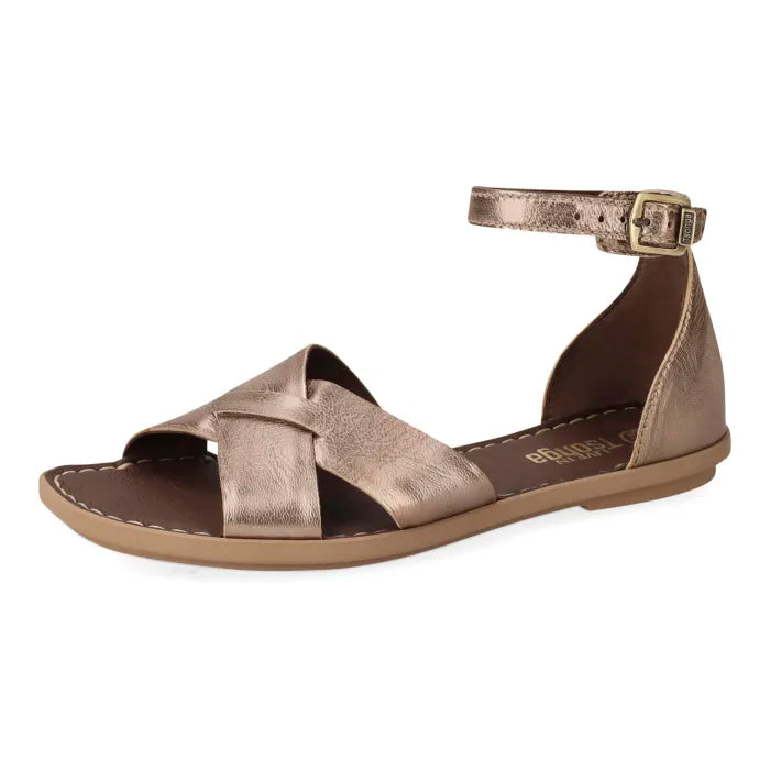 A metallic bronze leather flat sandal with crisscrossing front straps, a slim ankle strap with a gold-tone buckle, and a brown footbed, shown against a plain white background.