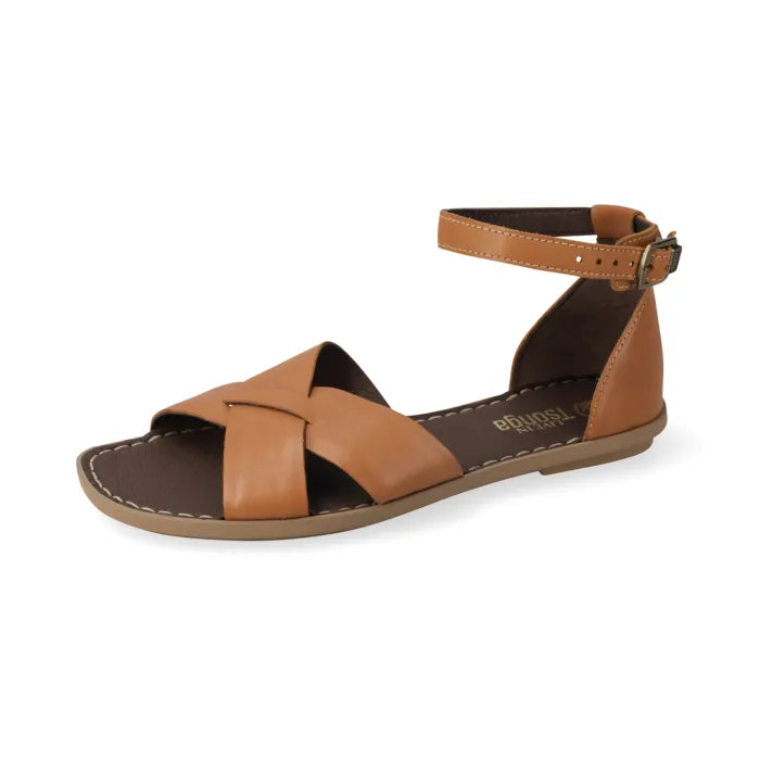 A tan leather flat sandal with crisscrossing straps, an ankle strap with a buckle, and a contoured sole, shown on a white background.