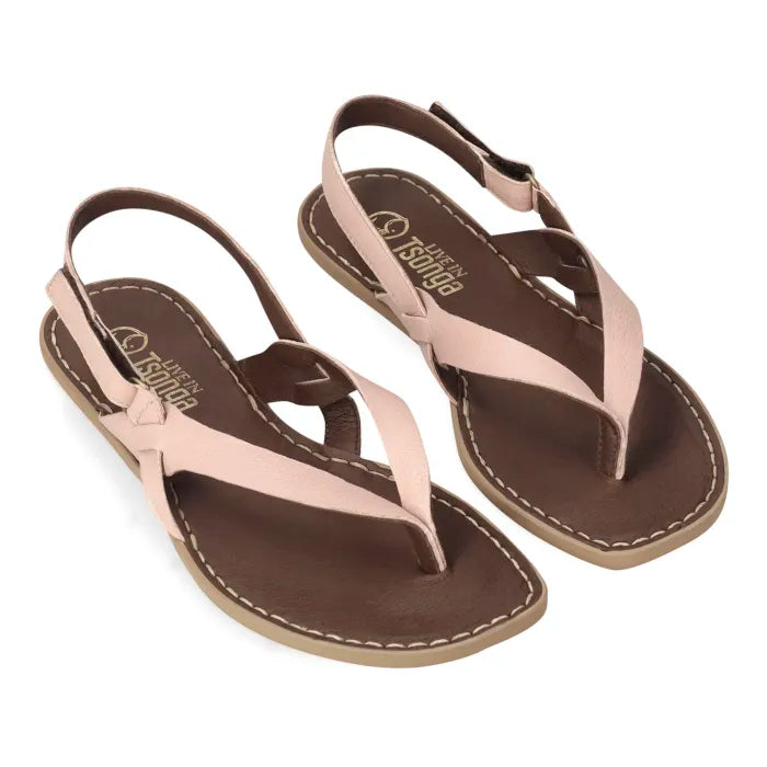 A pair of women's flat thong sandals with light pink straps and brown footbeds, shown on a plain white background.