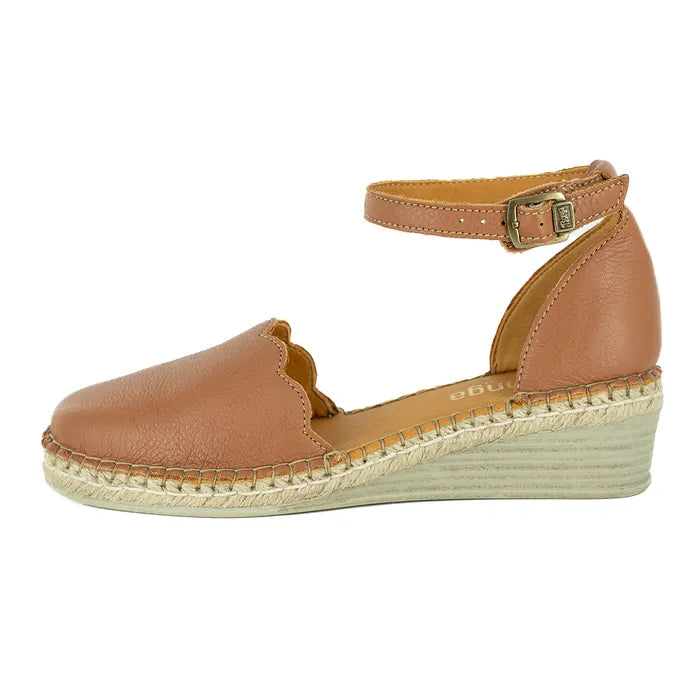 Tan wedge sandal with espadrille sole on a white background