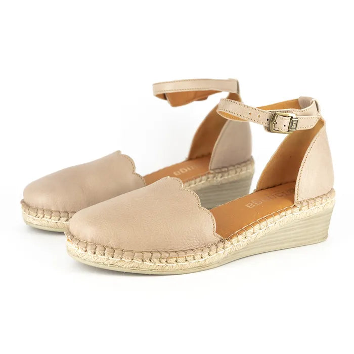 Beige wedge sandals with espadrille sole on a white background