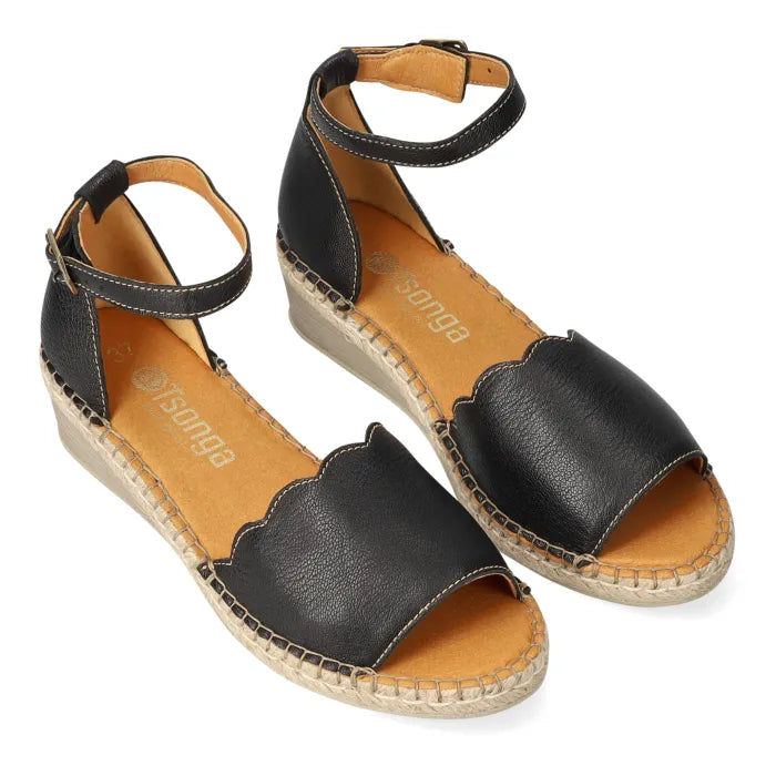 Black espadrille wedge sandal with ankle strap.