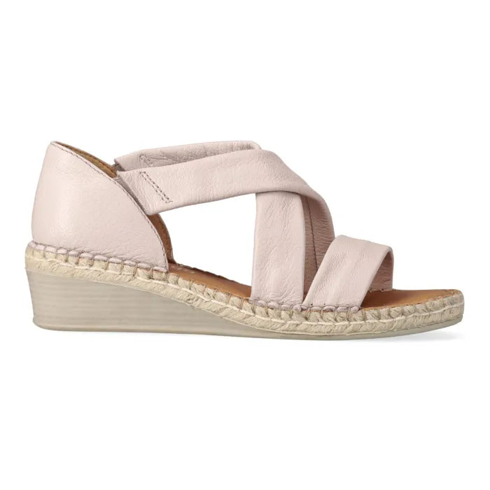 Beige wedge sandal with criss-cross straps on a white background