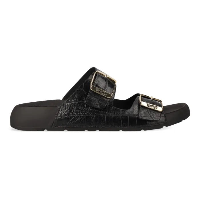 A single black slide sandal with a crocodile-embossed texture, featuring two adjustable straps with gold-tone buckles branded 'Tsonga'.