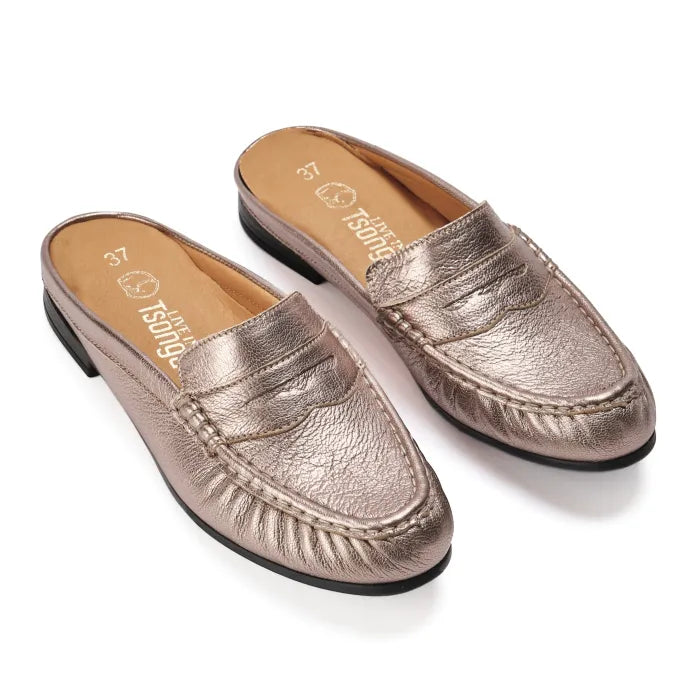 Pair of metallic loafers on a white background