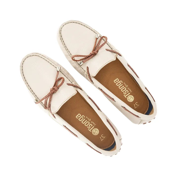 Pair of cream-colored loafers with brown accents on a white background