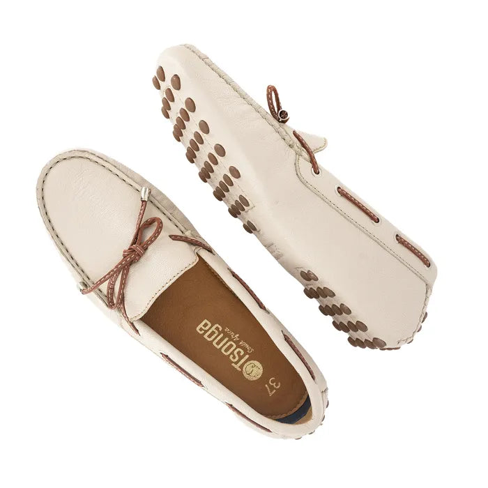 Pair of beige loafers with brown accents on a white background