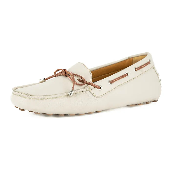 Cream loafer shoe with brown laces on a white background