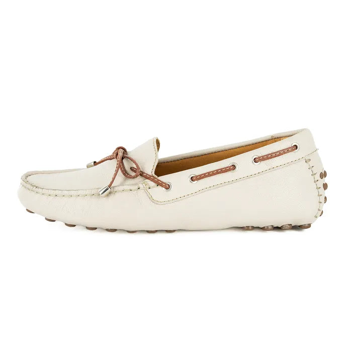 Cream loafer shoe with brown laces on a white background