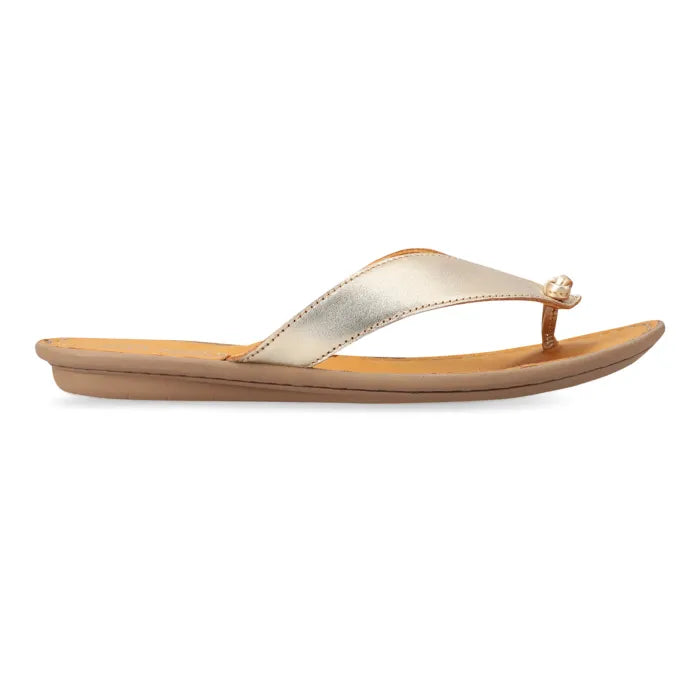 A single women's thong sandal shown in side profile on a white background. The upper strap is metallic champagne gold with a small decorative pearl-like accent at the toe loop, and the footbed is tan.