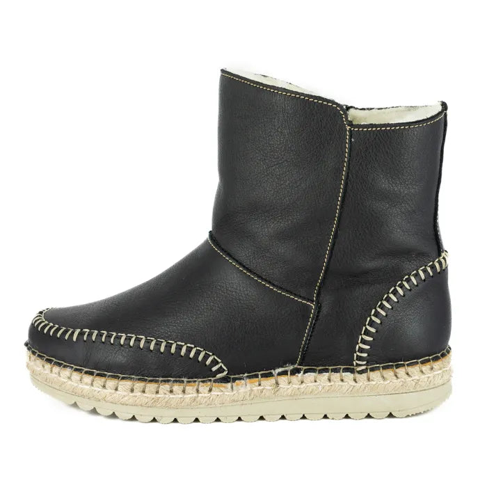 Black leather boot with off white sole on a white background