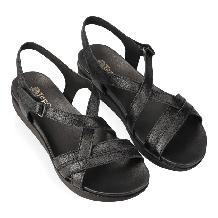 Black sandal with platform sole on a white background