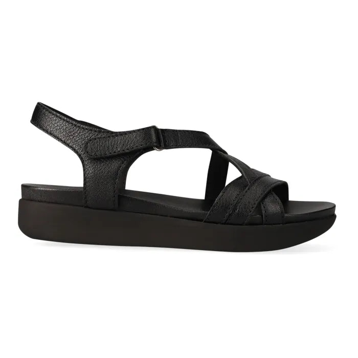 Black sandal with platform sole on a white background