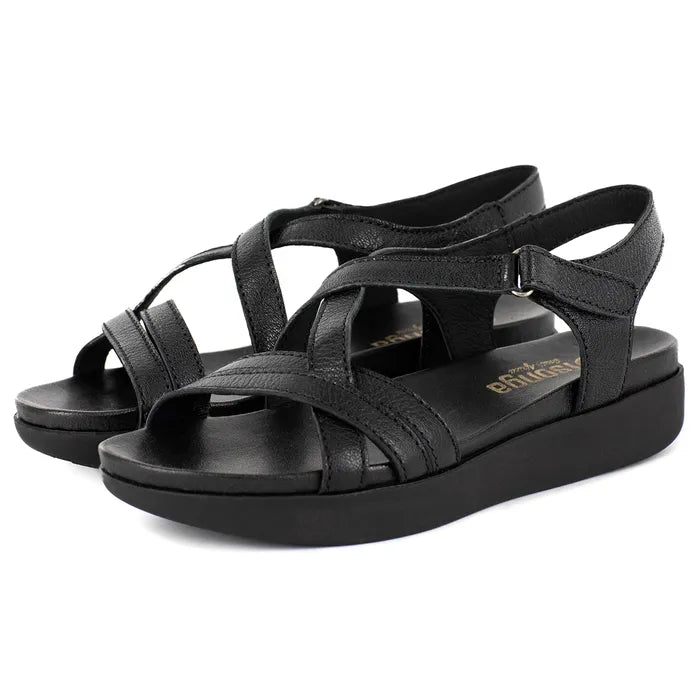 Black sandals with criss-cross straps on a white background