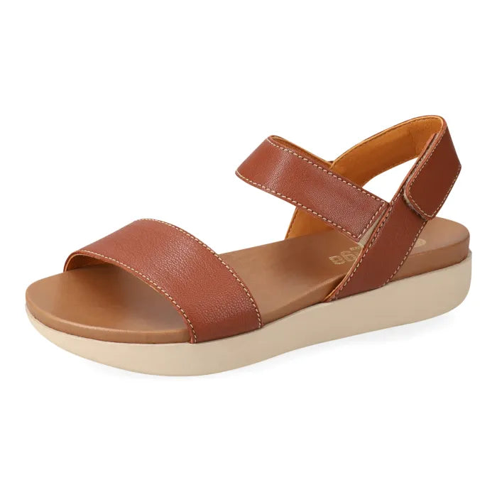 Brown sandal with multiple straps on a platform sole on a white background
