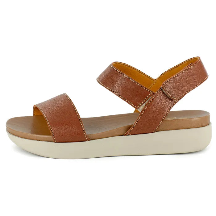 Brown sandal with a off-white sole on a white background