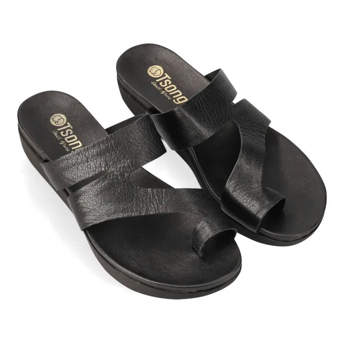 Black strappy sandal with toe-post on a platform