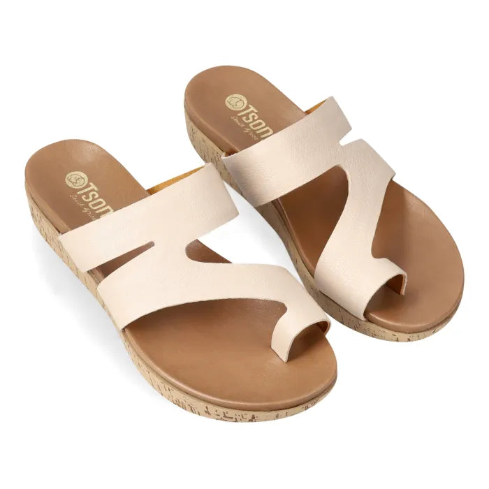 Cream strappy sandal with toe-post on a platform