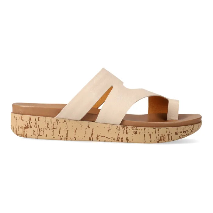 Cream strappy sandal with toe-post on a platform