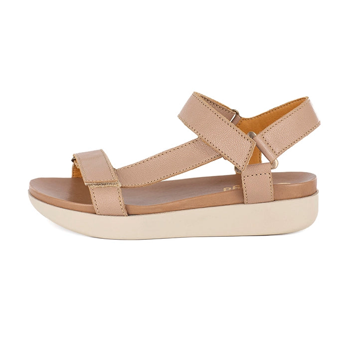 Beige sandal with a platform sole on a white background