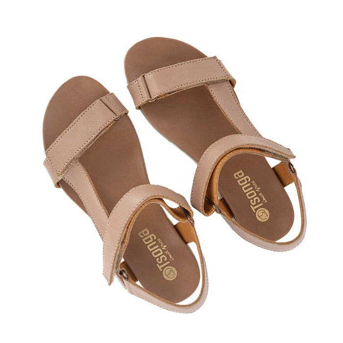 Pair of beige sandals on a white background