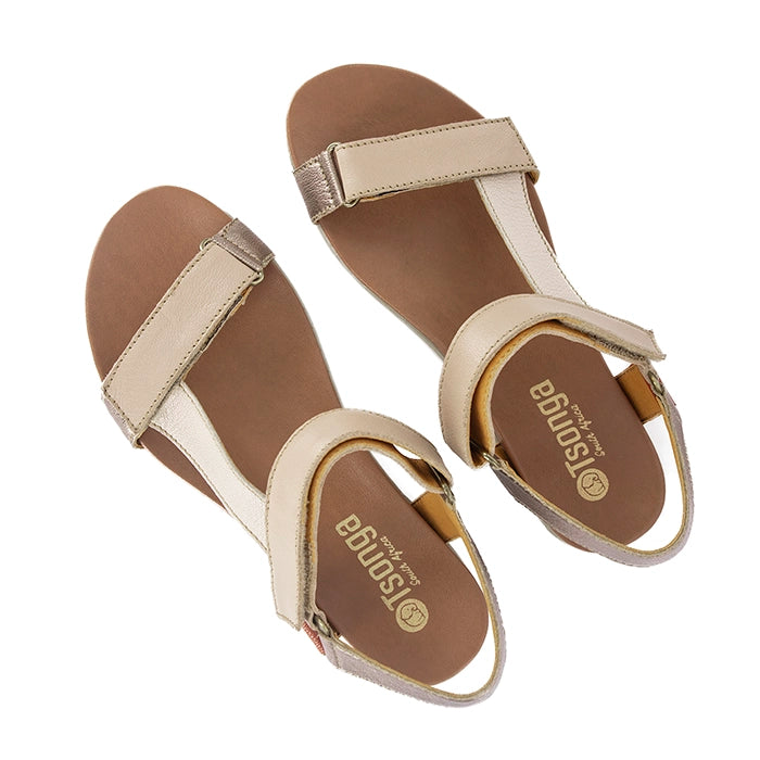 Pair of beige sandals with metallic accents on a white background