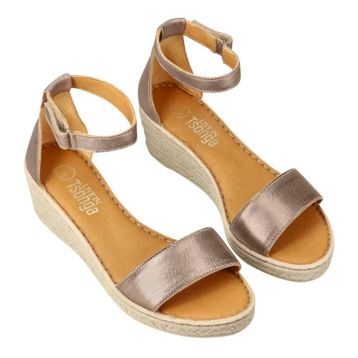 A metallic gold wedge sandal with an ankle strap and a platform sole, shown from above on a white background.