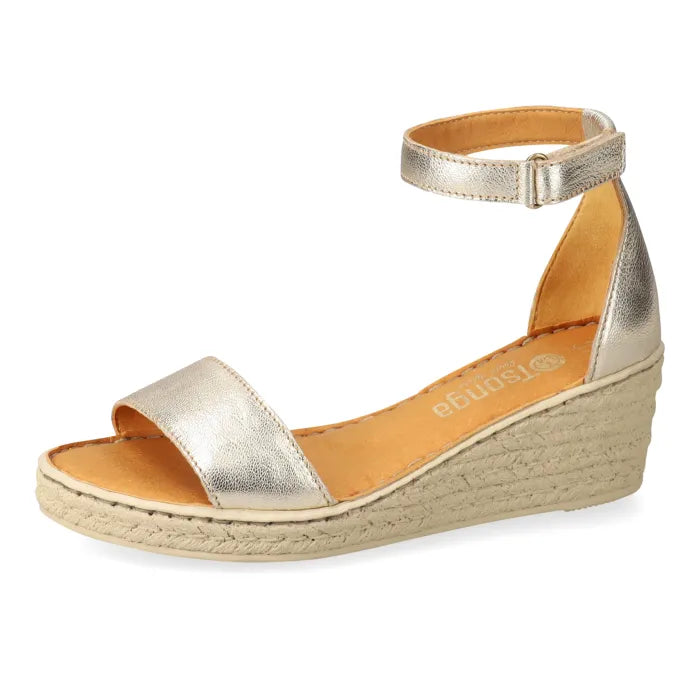 Gold wedge sandal with espadrille print sole on a white background