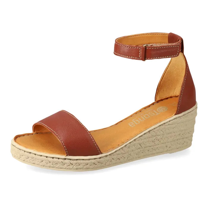 Brown wedge sandal with espadrille print sole on a white background