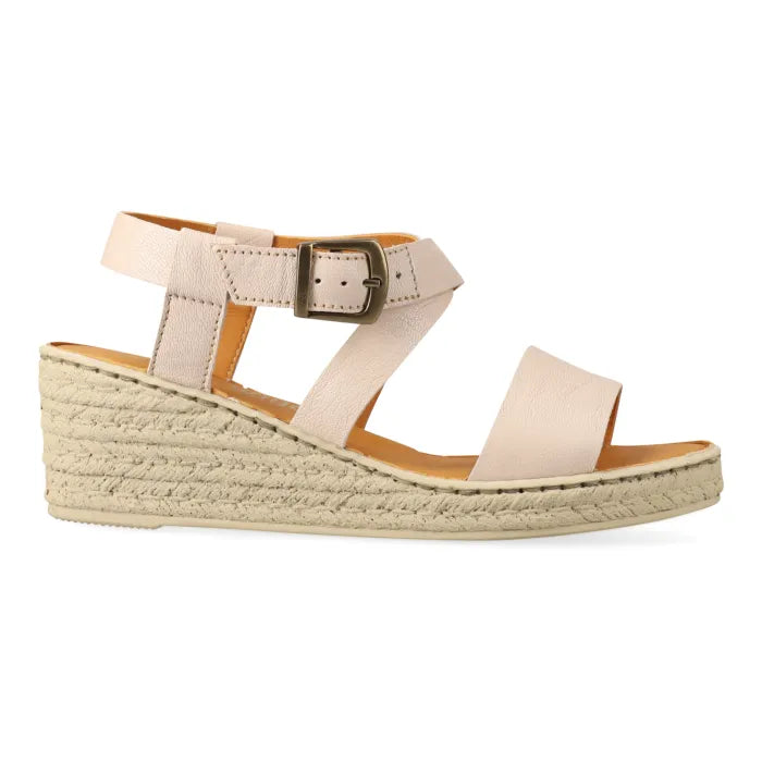 Beige wedge sandal with espadrille print sole on a white background