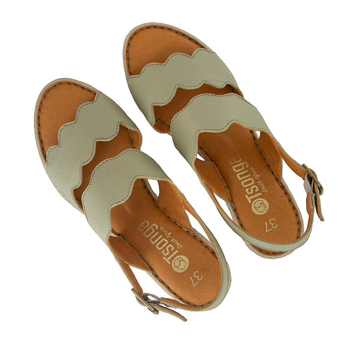 Pair of sandals with light green straps on a white background