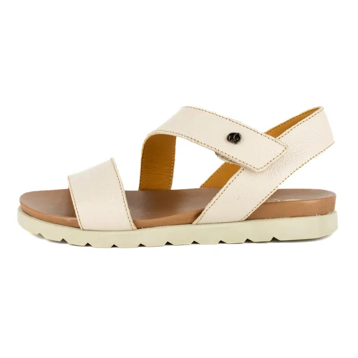 Beige sandal with a off white sole on a white background