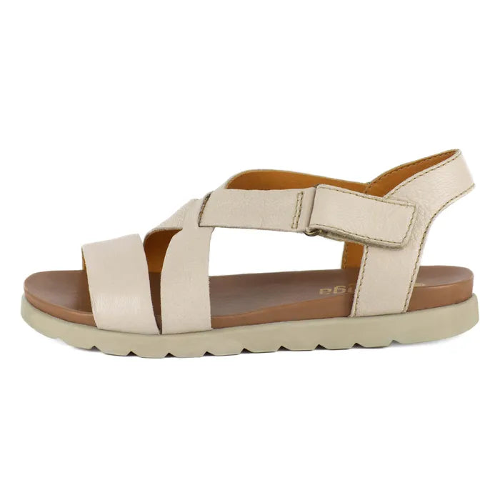 Beige sandal with a off-white sole on a white background