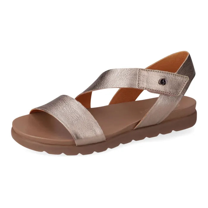Metallic sandal with brown sole on a white background