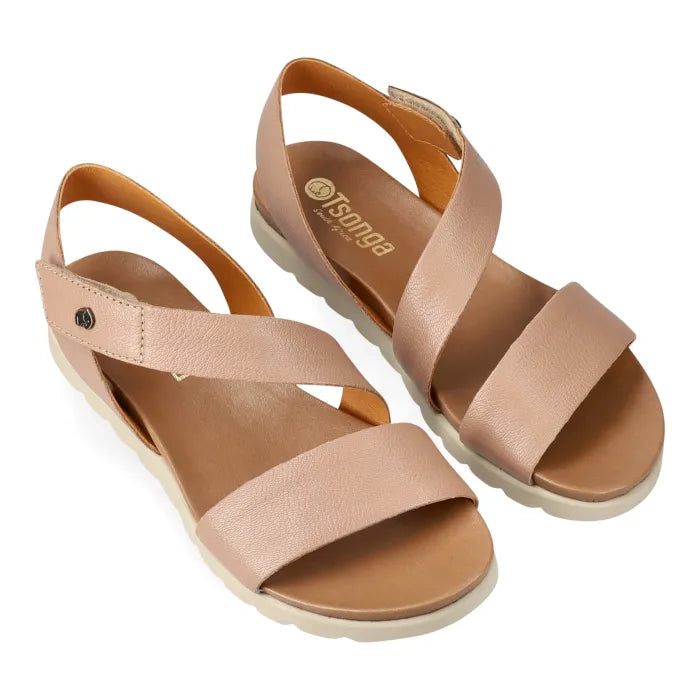Pair of beige sandals with a visible brand logo on a white background