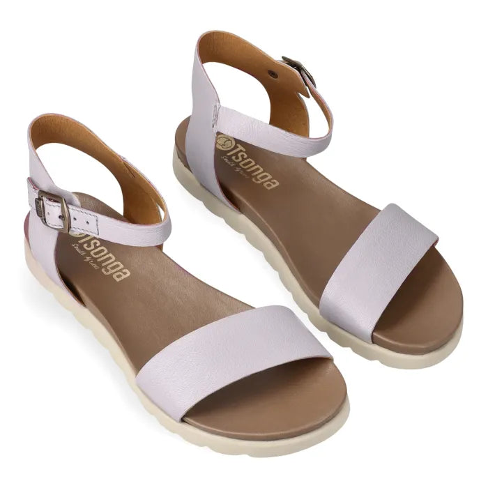 Pair of sandals with light grey straps and off white soles on a white background
