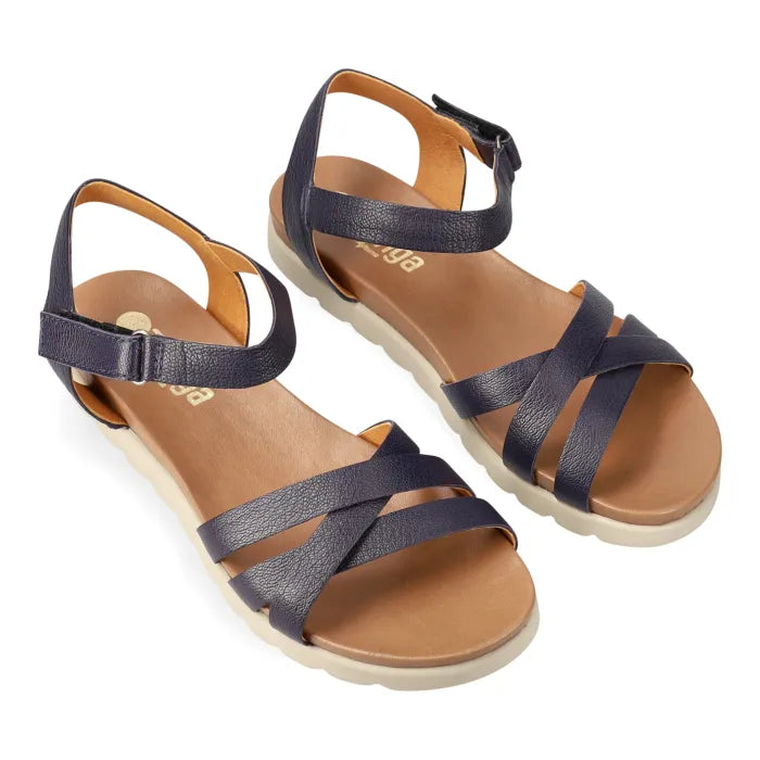 Navy sandals on off-white soles on a white background