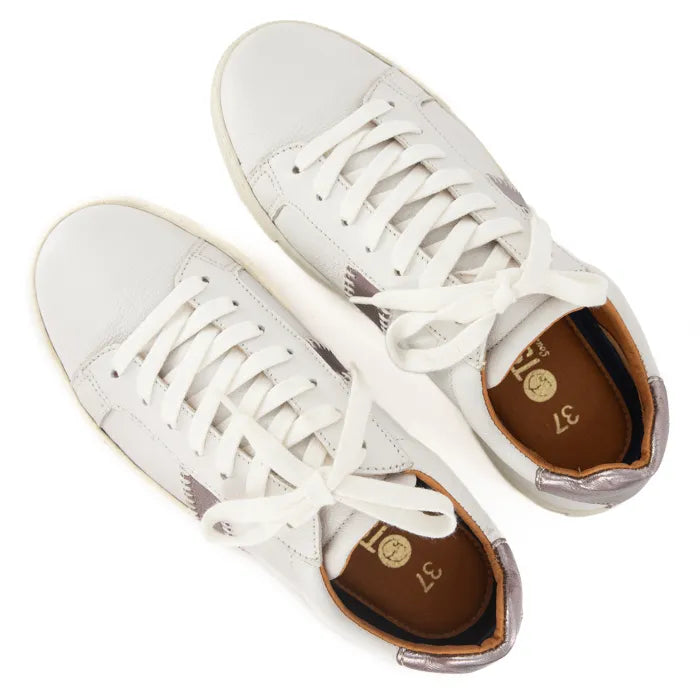 White sneakers with white soles on a white background