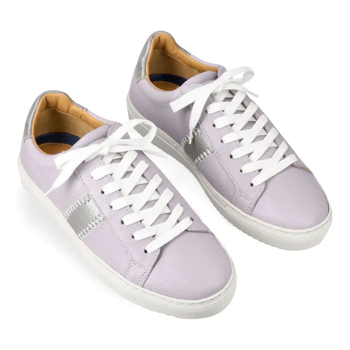 Pair of light grey sneakers with white laces on a white background
