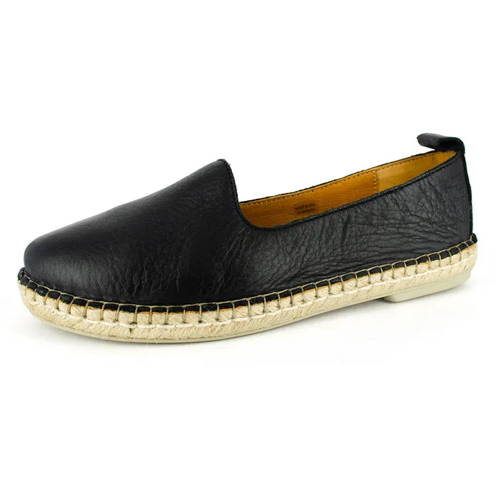 Black leather espadrille shoe on a white background