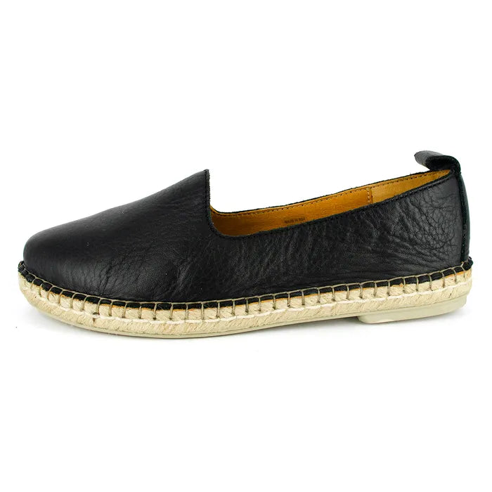 Black slip-on shoe on a white background