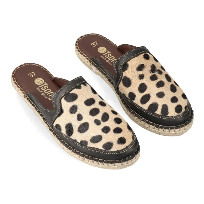 Pair of spotted print sandals with brown soles on a white background
